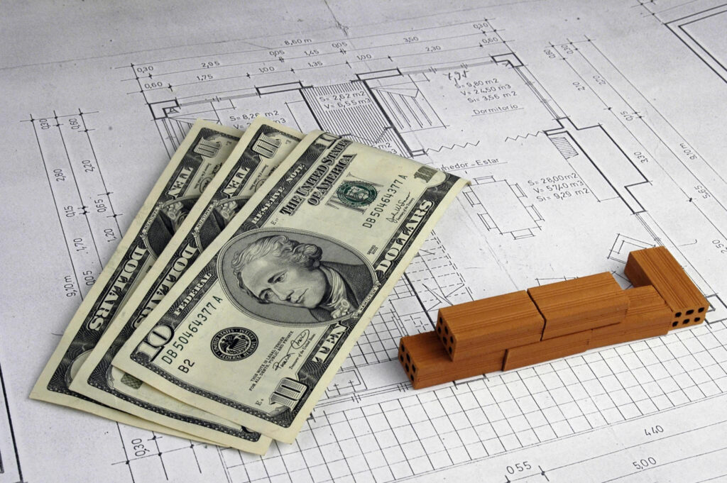 Architects salaries , plan and money showing the essence of the 