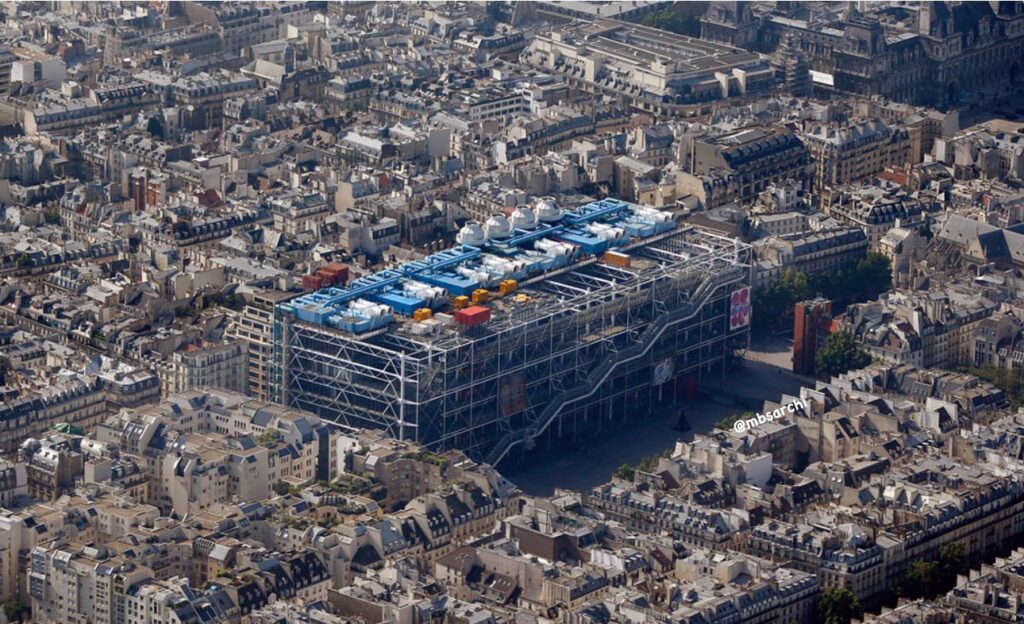 Aerial view of the Centre Pompidou surrounded by the Parisian landscape.